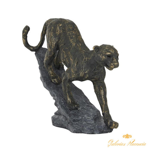 Escultura decorativa de leopardo en acabado negro y dorado.